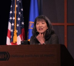 Grace Peng speaking at the podium