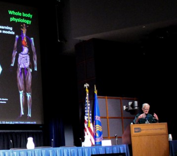 Peter Hunter speaking at the podium